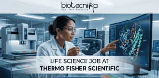 Latest Life Science Job at Thermo Fisher Scientific | Apply Online Here Latest Life Science Job at Thermo Fisher Scientific Apply Online Here. An advertisement for a Life Science Job at Thermo Fisher Scientific, featuring a female scientist in a laboratory pointing to a monitor displaying a molecular model of a protein-drug interaction. Text in the center reads: "LIFE SCIENCE JOB AT THERMO FISHER SCIENTIFIC". A blue button at the bottom says "APPLY NOW". The Biotecnika logo with the tagline "Your Bio Resource" is at the top. Microplates and other lab equipment are visible around her.