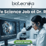 Latest MSc Life Science Job at Dr. Reddy’s | Apply Before Deadline! Latest MSc Life Science Job at Dr. Reddy's Apply Before Deadline!. An advertisement image for an MSc Life Science job at Dr. Reddy's, featuring a female scientist in a modern research lab examining a microscope. Monitors in the background display molecular models, graphs, and text including "DRUG-TARGET INTERACTION STUDY" and "PRESTIGIOUS CAREER PATH." At the top of the image is the headline "MSc Life Science Job at Dr. Reddy's" alongside the Biotecnika logo, and a green "APPLY NOW" button is at the bottom. Other lab staff and a world map are visible in the background.