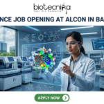 Life Science Job Opening at Alcon in Bangalore | Apply Before It’s Gone Life Science Job Opening at Alcon in Bangalore. A corporate job advertisement banner for a Life Science Job Opening at Alcon in Bangalore. The image features a female scientist of South Asian descent in a high-tech laboratory, interacting with a glowing holographic 3D protein-drug molecular model. The background shows advanced lab equipment, data monitors, and a view of modern Bangalore buildings through a large window. The Biotecnika logo is at the top center, the headline is in bold dark text, and a green 'Apply Now' button is located at the bottom.