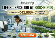Life Science Job at BRIC-NIPGR 2026 | Earn Upto ₹42,000/- per month + 27% HRA Life Science Job at BRIC-NIPGR 2026 Earn Upto ₹42,000- per month + 27% HRA. An illustrated advertisement for a Life Science Job at BRIC-NIPGR, presented by Biotecnika. The image depicts a female researcher working in a modern laboratory and greenhouse environment with plant growth data monitors. A prominent gold banner highlights a salary offer of "EARN UPTO ₹42,000/- PER MONTH + 27% HRA". At the bottom, there is a large, orange-red "APPLY NOW" button.