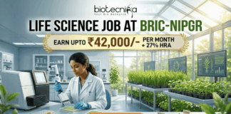 Life Science Job at BRIC-NIPGR 2026 | Earn Upto ₹42,000/- per month + 27% HRA Life Science Job at BRIC-NIPGR 2026 Earn Upto ₹42,000- per month + 27% HRA. An illustrated advertisement for a Life Science Job at BRIC-NIPGR, presented by Biotecnika. The image depicts a female researcher working in a modern laboratory and greenhouse environment with plant growth data monitors. A prominent gold banner highlights a salary offer of "EARN UPTO ₹42,000/- PER MONTH + 27% HRA". At the bottom, there is a large, orange-red "APPLY NOW" button.
