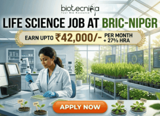 Life Science Job at BRIC-NIPGR 2026 | Earn Upto ₹42,000/- per month + 27% HRA Life Science Job at BRIC-NIPGR 2026 Earn Upto ₹42,000- per month + 27% HRA. An illustrated advertisement for a Life Science Job at BRIC-NIPGR, presented by Biotecnika. The image depicts a female researcher working in a modern laboratory and greenhouse environment with plant growth data monitors. A prominent gold banner highlights a salary offer of "EARN UPTO ₹42,000/- PER MONTH + 27% HRA". At the bottom, there is a large, orange-red "APPLY NOW" button.