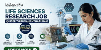 Life Sciences Research Job at IISER Thiruvananthapuram Earn Upto ₹37,000 Salary! A professional recruitment banner for a "Life Sciences Research Job @ IISER Thiruvananthapuram" featuring the Biotecnika logo. The image shows a female scientist in a lab coat and blue gloves using a pipette on a well plate, surrounded by high-tech laboratory equipment and computer monitors displaying molecular drug structures. A prominent callout reads "Earn Upto ₹37,000 Salary!" alongside icons for drug discovery, cutting-edge research, and expert mentorship. A green "Apply Now" button is positioned at the bottom left.