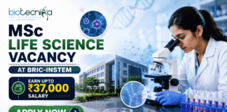 MSc Life Science Vacancy at BRIC-inStem in Bangalore Apply. Featured banner for “MSc Life Science Vacancy at BRIC-inStem” featuring the Biotecnika logo at the top, a life sciences researcher using a microscope in a modern biotechnology laboratory, DNA and molecular research-themed graphics, a salary highlight showing “Earn Upto ₹37,000,” a research institute campus backdrop, and a bold “Apply Now” button at the bottom.