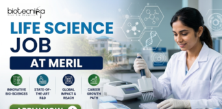 Meril Life Science Job 2026 | Research Role in Gujarat for M.Sc & PhD Candidates Meril Life Science Job 2026 Research Role in Gujarat for M.Sc & PhD Candidates. Meril Life Science Job 2026 Research Role in Gujarat for M.Sc & PhD Candidates. A professional recruitment banner for a "Life Science Job at Meril," featuring the Biotecnika logo at the top left. On the right, a female scientist in a white lab coat is shown working in a bright, modern laboratory, using a multichannel pipette on a microplate. The left side displays the bold headline "LIFE SCIENCE JOB AT MERIL" and four circular icons representing: Innovative Bio-sciences, State-of-the-Art R&D, Global Impact & Reach, and Career Growth Path. The background features floating scientific diagrams and a view of a research campus through a window. A prominent green "Apply Now" button and the website "www.biotecnika.org" are located at the bottom.