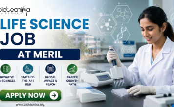 Meril Life Science Job 2026 | Research Role in Gujarat for M.Sc & PhD Candidates Meril Life Science Job 2026 Research Role in Gujarat for M.Sc & PhD Candidates. Meril Life Science Job 2026 Research Role in Gujarat for M.Sc & PhD Candidates. A professional recruitment banner for a "Life Science Job at Meril," featuring the Biotecnika logo at the top left. On the right, a female scientist in a white lab coat is shown working in a bright, modern laboratory, using a multichannel pipette on a microplate. The left side displays the bold headline "LIFE SCIENCE JOB AT MERIL" and four circular icons representing: Innovative Bio-sciences, State-of-the-Art R&D, Global Impact & Reach, and Career Growth Path. The background features floating scientific diagrams and a view of a research campus through a window. A prominent green "Apply Now" button and the website "www.biotecnika.org" are located at the bottom.