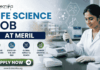 Meril Life Science Job 2026 | Research Role in Gujarat for M.Sc & PhD Candidates Meril Life Science Job 2026 Research Role in Gujarat for M.Sc & PhD Candidates. A professional recruitment banner for a "Life Science Job at Meril," featuring the Biotecnika logo at the top left. On the right, a female scientist in a white lab coat is shown working in a bright, modern laboratory, using a multichannel pipette on a microplate. The left side displays the bold headline "LIFE SCIENCE JOB AT MERIL" and four circular icons representing: Innovative Bio-sciences, State-of-the-Art R&D, Global Impact & Reach, and Career Growth Path. The background features floating scientific diagrams and a view of a research campus through a window. A prominent green "Apply Now" button and the website "www.biotecnika.org" are located at the bottom.