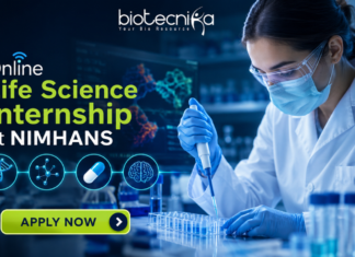 Online Life Science Internship at NIMHANS Opportunity for UG & PG Students “Featured banner for an Online Life Science Internship at NIMHANS, showing a female scientist conducting drug research in a modern biotech laboratory with test tubes, microscope, and digital brain scan displays. The Biotecnika logo is placed at the top, with a glowing ‘Apply Now’ button at the bottom and futuristic blue scientific graphics in the background.”