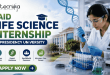 Paid Life Science Internship at Presidency University | Opportunity for MSc Candidates! Paid Life Science Internship at Presidency University Project Intern Opportunity for MSc Candidates! Featured banner for “Paid Life Science Internship at Presidency University” featuring the Biotecnika logo at the top, a life sciences researcher working in a modern laboratory, a university campus backdrop, biotechnology-themed graphics, and a bold “Apply Now” button at the bottom.