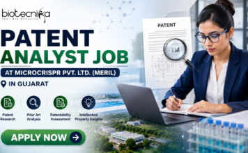 Latest Patent Analyst Job at Microcrispr Pvt. Ltd. (Meril) in Gujarat | Apply Now Patent Analyst Job at Microcrispr Pvt. Ltd. (Meril) in Gujarat Apply. Featured banner for “Patent Analyst Job at Microcrispr Pvt. Ltd. (Meril) in Gujarat” featuring the Biotecnika logo at the top, a professional patent analyst working on a laptop in a modern office setting, patent document and intellectual property-themed graphics, biotechnology research visuals, and a bold “Apply Now” button at the bottom.