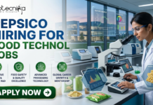 PepsiCo Hiring for Food Technology Jobs 2026 | BSc & BTech Candidates Must Check! PepsiCo Hiring for Food Technology Jobs 2026 BSc & BTech Candidates Must Check! A recruitment banner for biotecnika announcing: 'PEPSICO HIRING FOR FOOD TECHNOLOGY JOBS'. The image features a female scientist in a modern laboratory looking into a microscope, surrounded by snacks like chips and can samples. Floating digital windows show product analysis data including 'TEXTURE PROFILE', 'FLAVOR COLOR', and 'MICRO-STRUCTURE' for snacks. Four circular green icons with descriptive text are listed below the headline: 'INNOVATIVE SNACK & BEVERAGE R&D', 'FOOD SAFETY & QUALITY EXCELLENCE', 'ADVANCED PROCESSING TECHNOLOGY', and 'GLOBAL CAREER GROWTH & MENTORSHIP'. At the bottom left, a prominent green button with a right arrow says 'APPLY NOW'.