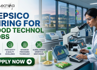 PepsiCo Hiring for Food Technology Jobs 2026 | BSc & BTech Candidates Must Check! PepsiCo Hiring for Food Technology Jobs 2026 BSc & BTech Candidates Must Check! A recruitment banner for biotecnika announcing: 'PEPSICO HIRING FOR FOOD TECHNOLOGY JOBS'. The image features a female scientist in a modern laboratory looking into a microscope, surrounded by snacks like chips and can samples. Floating digital windows show product analysis data including 'TEXTURE PROFILE', 'FLAVOR COLOR', and 'MICRO-STRUCTURE' for snacks. Four circular green icons with descriptive text are listed below the headline: 'INNOVATIVE SNACK & BEVERAGE R&D', 'FOOD SAFETY & QUALITY EXCELLENCE', 'ADVANCED PROCESSING TECHNOLOGY', and 'GLOBAL CAREER GROWTH & MENTORSHIP'. At the bottom left, a prominent green button with a right arrow says 'APPLY NOW'.