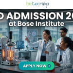 PhD Admission 2026 at Bose Institute Life Science Opportunity. A professional and high-tech featured image for the Project Research Scientist Recruitment 2026 at ICMR-NIN. The image depicts a female scientist in a white lab coat interacting with a glowing, transparent digital interface that displays complex nutritional genomics data, 3D DNA structures, and metabolic charts. The background shows a modern, sunlit laboratory with a city skyline visible through the window. The Biotecnika logo is featured at the top center, and a prominent teal "Apply Now" button is positioned at the bottom.