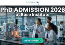 PhD Admission 2026 at Bose Institute Life Science Opportunity. A professional and high-tech featured image for the Project Research Scientist Recruitment 2026 at ICMR-NIN. The image depicts a female scientist in a white lab coat interacting with a glowing, transparent digital interface that displays complex nutritional genomics data, 3D DNA structures, and metabolic charts. The background shows a modern, sunlit laboratory with a city skyline visible through the window. The Biotecnika logo is featured at the top center, and a prominent teal "Apply Now" button is positioned at the bottom.