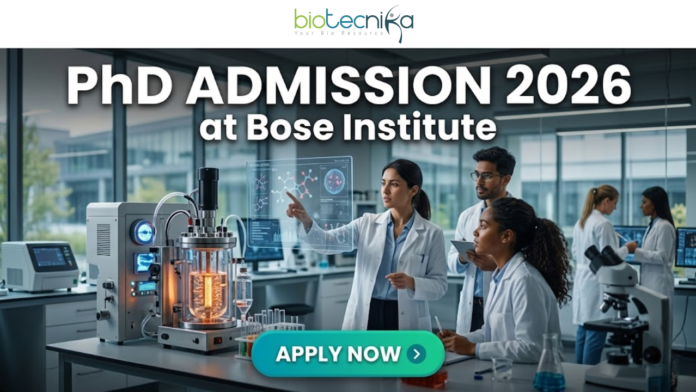 PhD Admission 2026 at Bose Institute Life Science Opportunity PhD Admission 2026 at Bose Institute Life Science Opportunity. A professional and high-tech featured image for the Project Research Scientist Recruitment 2026 at ICMR-NIN. The image depicts a female scientist in a white lab coat interacting with a glowing, transparent digital interface that displays complex nutritional genomics data, 3D DNA structures, and metabolic charts. The background shows a modern, sunlit laboratory with a city skyline visible through the window. The Biotecnika logo is featured at the top center, and a prominent teal "Apply Now" button is positioned at the bottom.