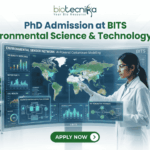 PhD Admission at BITS Environmental Science & Technology Lab – Apply Before The Deadline! PhD Admission at BITS Environmental Science & Technology Lab – Apply Before The Deadline!. A recruitment graphic for the PhD program in BITS Environmental Science & Technology Lab, presented by Biotecnika. It depicts a female scientist in a white lab coat and safety glasses standing in a modern research laboratory, meticulously interacting with a large, futuristic, interactive holographic display stand. The display frame is titled 'Environmental Sensor Network: AI-Powered Contaminant Modelling' and features a global map with data points, along with multiple detailed windows showing metrics and schematics for 'Air Quality Index', 'Water Purity', 'Soil Health', 'Advanced Water Purification Systems', and 'Bio-Remediation Pathways'. The main text 'PhD Admission at BITS Environmental Science & Technology Lab' is prominent at the top center. Below the display stand is a large, green 'APPLY NOW' button with an arrow. The tagline 'Unlock Innovation in Environmental Technology' is in green text at the bottom. The Biotecnika logo is at the very top center.