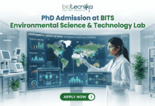 PhD Admission at BITS Environmental Science & Technology Lab – Apply Before The Deadline! PhD Admission at BITS Environmental Science & Technology Lab – Apply Before The Deadline!. A recruitment graphic for the PhD program in BITS Environmental Science & Technology Lab, presented by Biotecnika. It depicts a female scientist in a white lab coat and safety glasses standing in a modern research laboratory, meticulously interacting with a large, futuristic, interactive holographic display stand. The display frame is titled 'Environmental Sensor Network: AI-Powered Contaminant Modelling' and features a global map with data points, along with multiple detailed windows showing metrics and schematics for 'Air Quality Index', 'Water Purity', 'Soil Health', 'Advanced Water Purification Systems', and 'Bio-Remediation Pathways'. The main text 'PhD Admission at BITS Environmental Science & Technology Lab' is prominent at the top center. Below the display stand is a large, green 'APPLY NOW' button with an arrow. The tagline 'Unlock Innovation in Environmental Technology' is in green text at the bottom. The Biotecnika logo is at the very top center.