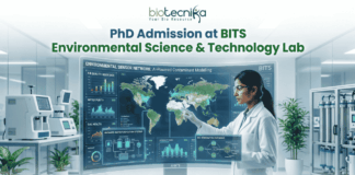 PhD Admission at BITS Environmental Science & Technology Lab – Apply Before The Deadline!. A recruitment graphic for the PhD program in BITS Environmental Science & Technology Lab, presented by Biotecnika. It depicts a female scientist in a white lab coat and safety glasses standing in a modern research laboratory, meticulously interacting with a large, futuristic, interactive holographic display stand. The display frame is titled 'Environmental Sensor Network: AI-Powered Contaminant Modelling' and features a global map with data points, along with multiple detailed windows showing metrics and schematics for 'Air Quality Index', 'Water Purity', 'Soil Health', 'Advanced Water Purification Systems', and 'Bio-Remediation Pathways'. The main text 'PhD Admission at BITS Environmental Science & Technology Lab' is prominent at the top center. Below the display stand is a large, green 'APPLY NOW' button with an arrow. The tagline 'Unlock Innovation in Environmental Technology' is in green text at the bottom. The Biotecnika logo is at the very top center.
