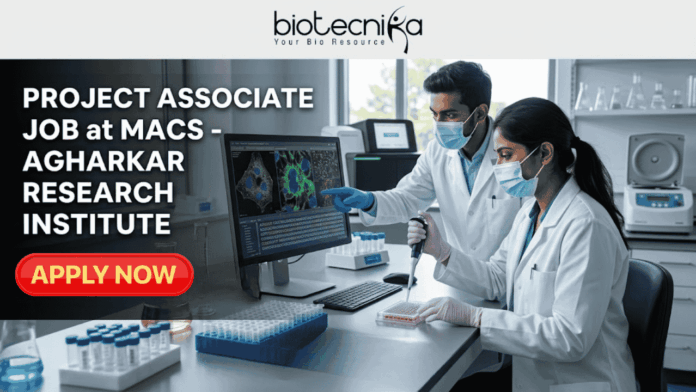 Project Associate Job at MACS - Agharkar Research Institute Project Associate Job at MACS - Agharkar Research Institute. A detailed job advertisement graphic for a Project Associate position at MACS - Agharkar Research Institute in Pune, India, from Biotecnika, 'Your Bio Resource'. The left side displays bold text. On the right, a photograph shows two masked scientists in a modern laboratory, one pointing to a screen with colorful cellular images and the other using a pipette. A teal button at the bottom reads 'Apply Now'.