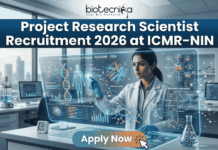 Project Research Scientist Recruitment 2026 at ICMR-NIN | Earn Upto Rs. 56,000/- Project Research Scientist Recruitment 2026 at ICMR-NIN. A professional and high-tech featured image for the Project Research Scientist Recruitment 2026 at ICMR-NIN. The image depicts a female scientist in a white lab coat interacting with a glowing, transparent digital interface that displays complex nutritional genomics data, 3D DNA structures, and metabolic charts. The background shows a modern, sunlit laboratory with a city skyline visible through the window. The Biotecnika logo is featured at the top center, and a prominent teal "Apply Now" button is positioned at the bottom.