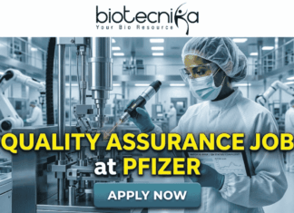 Quality Assurance Job at Pfizer | BSc & MSc Biotech Candidates Apply Now Quality Assurance Job at Pfizer BSc & MSc Biotech Candidates Apply Now. A promotional job banner with the Biotecnika logo at the top. Large yellow and white text reads: 'QUALITY ASSURANCE JOB at PFIZER'. The background is a photograph of a person in a full cleanroom suit and goggles, scanning equipment in a state-of-the-art pharmaceutical manufacturing lab. A turquoise 'APPLY NOW' button is at the bottom.