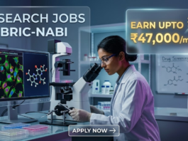 Research Jobs at NABI Recruitment 2026 – Apply Now. An advertisement image featuring text on the left, "RESEARCH JOBS AT BRIC-NABI", and a highlighted box on the right stating "EARN UPTO ₹47,000/month". The visual depicts a female researcher in a white lab coat looking into a microscope, with surrounding screens displaying molecular models and fluorescent cell cultures, and a whiteboard with drug screening protocols.