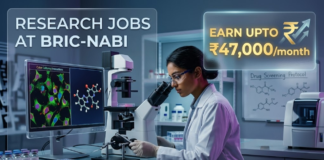 ₹47,000 Salary Biotechnology Vacancy at BRIC-NABI – Research Jobs for Life Science Graduates! Research Jobs at NABI Recruitment 2026 – Apply Now. An advertisement image featuring text on the left, "RESEARCH JOBS AT BRIC-NABI", and a highlighted box on the right stating "EARN UPTO ₹47,000/month". The visual depicts a female researcher in a white lab coat looking into a microscope, with surrounding screens displaying molecular models and fluorescent cell cultures, and a whiteboard with drug screening protocols.