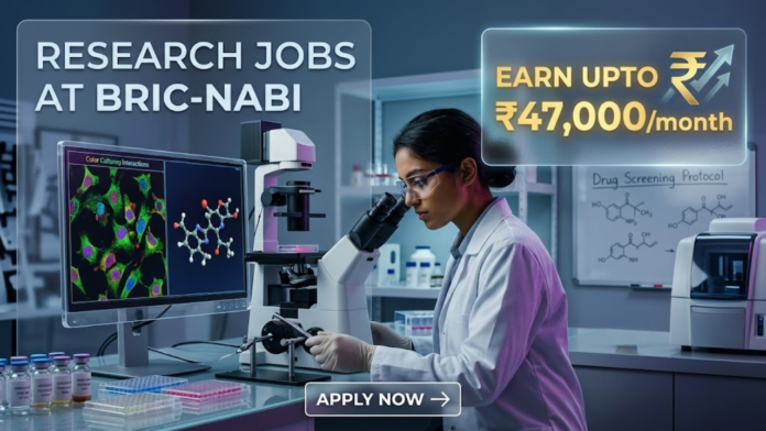 Research Jobs at NABI Recruitment 2026 – Apply Now. An advertisement image featuring text on the left, "RESEARCH JOBS AT BRIC-NABI", and a highlighted box on the right stating "EARN UPTO ₹47,000/month". The visual depicts a female researcher in a white lab coat looking into a microscope, with surrounding screens displaying molecular models and fluorescent cell cultures, and a whiteboard with drug screening protocols.