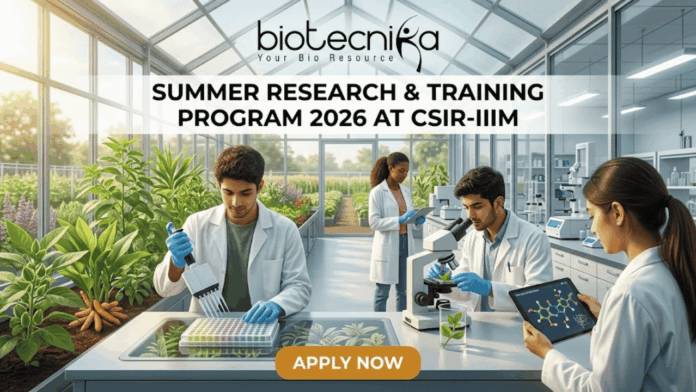 Summer Research & Training Program 2026 at CSIR-IIIM Summer Research & Training Program 2026 at CSIR-IIIM. A featured image for a job page set in a sunlit, modern research greenhouse. The interior is filled with flourishing green plants in raised beds. Four scientists in white lab coats are working among the flora. In the foreground, a South Asian man uses a pipette with a microplate on an illuminated screen-table. Beside him, another man holds a tablet displaying a linked molecular model near a microscope. In the background, a Black woman and another scientist work further back among lab equipment and plants. Light streams in through the glass walls and roof. The 'biotecnika Your Bio Resource' logo is at the top center. Large text on a central dark band reads: 'SUMMER RESEARCH & TRAINING PROGRAM 2026 AT CSIR-IIIM'. An orange button at the bottom center reads: 'APPLY NOW'. The overall scene is bright, collaborative, and scientifically focused.