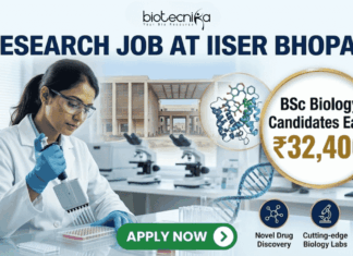 ₹32,400 Salary Research Job at IISER Bhopal | BSc Biology Candidates Apply Now ₹32,400 Salary Research Job at IISER Bhopal BSc Biology Candidates Apply Now. A recruitment banner for a "RESEARCH JOB AT IISER BHOPAL" by Biotecnika. The image features a female scientist in a lab coat pipetting into a microplate in a modern laboratory. A gold circular callout highlights that BSc Biology candidates can earn ₹32,400. The background shows the IISER Bhopal campus, molecular models (protein and DNA), and lab equipment. At the bottom right, three icons with text represent "Novel Drug Discovery," "Cutting-edge Biology Labs," and "Expert Mentorship." A prominent green "APPLY NOW" button is at the bottom center.