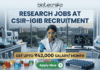 ₹42,000 Salary Research Jobs at Institute of Life Sciences | Apply Now ₹42,000 Salary Research Jobs at Institute of Life Sciences Apply Now. A job recruitment banner from Biotecnika for CSIR-IGIB. The headline reads 'RESEARCH JOBS AT CSIR-IGIB RECRUITMENT'. A female scientist in a lab coat uses a multi-channel pipette. The desk features beakers, a box of 'DRUG CANDIDATE' vials, and a monitor with a 3D molecular structure. A campus of buildings is visible through a large window. A gold banner highlights 'GET UPTO ₹42,000 SALARY/ MONTH'. An 'Apply Now' button is at the bottom.