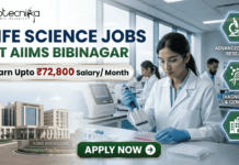 ₹72,800 Salary AIIMS Bibinagar Life Science Jobs 2026 | Research & Microbiology Openings ₹72,800 Salary AIIMS Bibinagar Life Science Jobs 2026 Research & Microbiology Openings. A professional corporate recruitment banner for "LIFE SCIENCE JOBS AT AIIMS BIBINAGAR" featuring the Biotecnika logo at the top. The image displays a focused female scientist in a white lab coat and safety glasses using a multichannel pipette in a state-of-the-art laboratory. An inset on the bottom left shows the modern AIIMS Bibinagar campus building. A prominent gold-bordered callout highlights "Earn Upto ₹72,800 Salary/ Month." Three teal hexagonal icons on the right represent "ADVANCED MEDICAL RESEARCH," "DIAGNOSTICS & GENETICS," and "CLINICAL APPLICATIONS." A green "APPLY NOW" button with a white arrow is positioned at the bottom center.