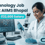 Biotechnology Job 2026 at AIIMS Bhopal with ₹33,600 Salary – Apply Now! Biotechnology Job 2026 at AIIMS Bhopal with ₹33,600 Salary – Apply Now! A corporate-style job featured image banner (1280x720) for "Biotechnology Job 2026 at AIIMS Bhopal" featuring the Biotecnika CRO logo at the top right. On the left, the main headline and a bright teal highlight bar reading "Earn Upto ₹33,600 Salary" are prominently displayed. The right side features a realistic, smiling young Indian female scientist in a white lab coat and blue gloves carefully using a pipette over a well plate in a modern medical laboratory. A computer monitor showing molecular structures is visible in the background, and a glowing teal "APPLY NOW" button sits at the bottom right.