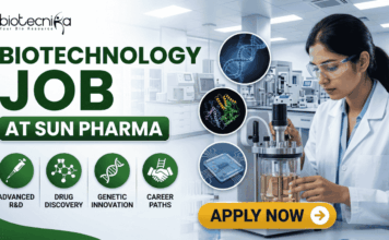 Biotechnology Job at Sun Pharma | Opportunity for MSc & MTech Candidates Biotechnology Job at Sun Pharma Opportunity for MSc & MTech Candidates. A professional promotional banner for a "Biotechnology Job at Sun Pharma." The top left displays the Biotecnika logo. The main header text boldly reads "BIOTECHNOLOGY JOB AT SUN PHARMA" in a green and dark color scheme. Below the title, four circular green icons are labeled: "ADVANCED R&D", "DRUG DISCOVERY", "GENETIC INNOVATION", and "CAREER PATHS". In the center, three floating circular graphics illustrate a DNA double helix, a colorful protein model, and a biochip. On the right side, a female researcher wearing a white lab coat and safety glasses works attentively with a laboratory bioreactor containing a golden liquid, set against a bright, modern pharmaceutical lab background. A prominent gold "APPLY NOW" button with an arrow sits at the bottom center-right.