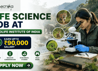 Wildlife Institute of India Recuitment 2026: Life Science Job with ₹90,000 Salary – Apply Before Deadline! Wildlife Institute of India Recuitment 2026 Life Science Job with ₹90,000 Salary – Apply Before Deadline! Featured banner for “Life Science Job at Wildlife Institute of India” featuring the Biotecnika logo at the top, a wildlife researcher conducting field-based biological research with a microscope in a natural forest setting, wildlife visuals including animals and biodiversity elements, a salary highlight showing “Earn Upto ₹90,000,” conservation and ecological research-themed graphics, and a bold “Apply Now” button at the bottom.