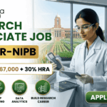 ₹67,000 Salary Research Associate Job at ICAR-NIPB– Apply Before Last Date! ₹67,000 Salary Research Associate Job at ICAR-NIPB. A professional promotional banner for a "Research Associate Job at ICAR-IARI." The top left corner features the Biotecnika logo. On the left side, bold text reads "RESEARCH ASSOCIATE JOB AT ICAR-IARI", sitting above a highlighted white badge that reads "Earn upto ₹67,000 + 30% HRA". Below the salary badge, four green circular icons are labeled: "AGRICULTURAL INNOVATION", "CROP BREEDING", "DATA ANALYTICS", and "BUILD RESEARCH CAREER". On the right side, a female researcher in a white lab coat and gloves works with a digital tablet and handheld scientific device at a lab counter. Through the large window behind her, the historic brick building and fields of the ICAR-IARI campus are visible. The far right includes three floating circular graphics showcasing plant cell structures, a wheat grain molecular model, and digital gene mapping data. A prominent green "APPLY NOW" button with an arrow is located at the bottom right.
