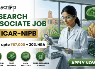 ₹67,000 Salary Research Associate Job at ICAR-NIPB– Apply Before Last Date! ₹67,000 Salary Research Associate Job at ICAR-NIPB. A professional promotional banner for a "Research Associate Job at ICAR-IARI." The top left corner features the Biotecnika logo. On the left side, bold text reads "RESEARCH ASSOCIATE JOB AT ICAR-IARI", sitting above a highlighted white badge that reads "Earn upto ₹67,000 + 30% HRA". Below the salary badge, four green circular icons are labeled: "AGRICULTURAL INNOVATION", "CROP BREEDING", "DATA ANALYTICS", and "BUILD RESEARCH CAREER". On the right side, a female researcher in a white lab coat and gloves works with a digital tablet and handheld scientific device at a lab counter. Through the large window behind her, the historic brick building and fields of the ICAR-IARI campus are visible. The far right includes three floating circular graphics showcasing plant cell structures, a wheat grain molecular model, and digital gene mapping data. A prominent green "APPLY NOW" button with an arrow is located at the bottom right.